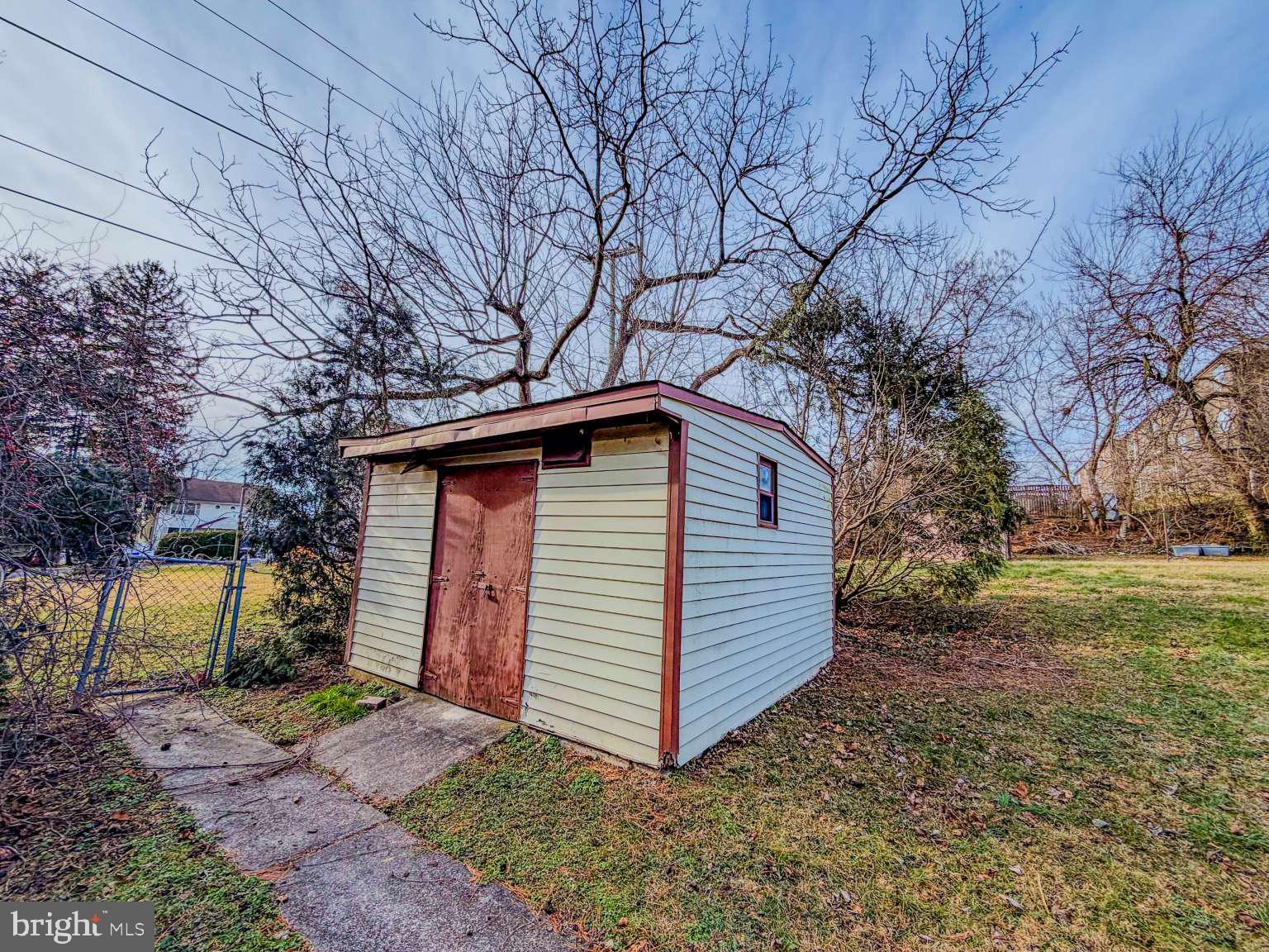 1424 Wayne Street Reading, PA 19601 - Photo 19 of 19 a front view of house with yard and trees in the background