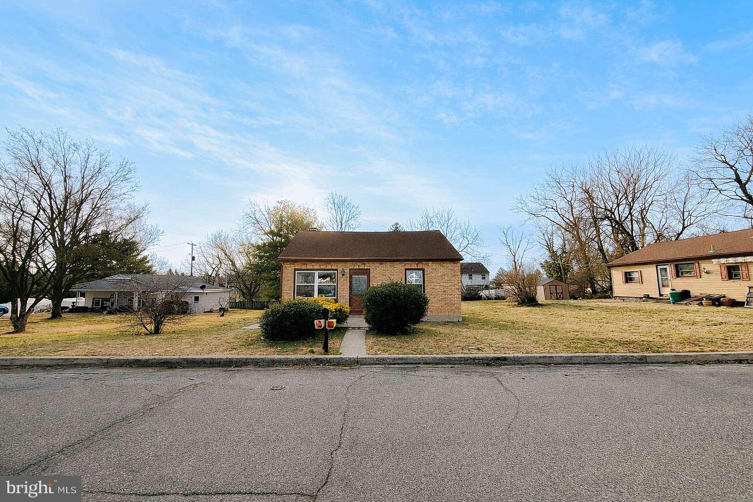 1424 Wayne Street Reading, PA 19601 - Photo 2 of 19 a front view of a house with a yard and trees