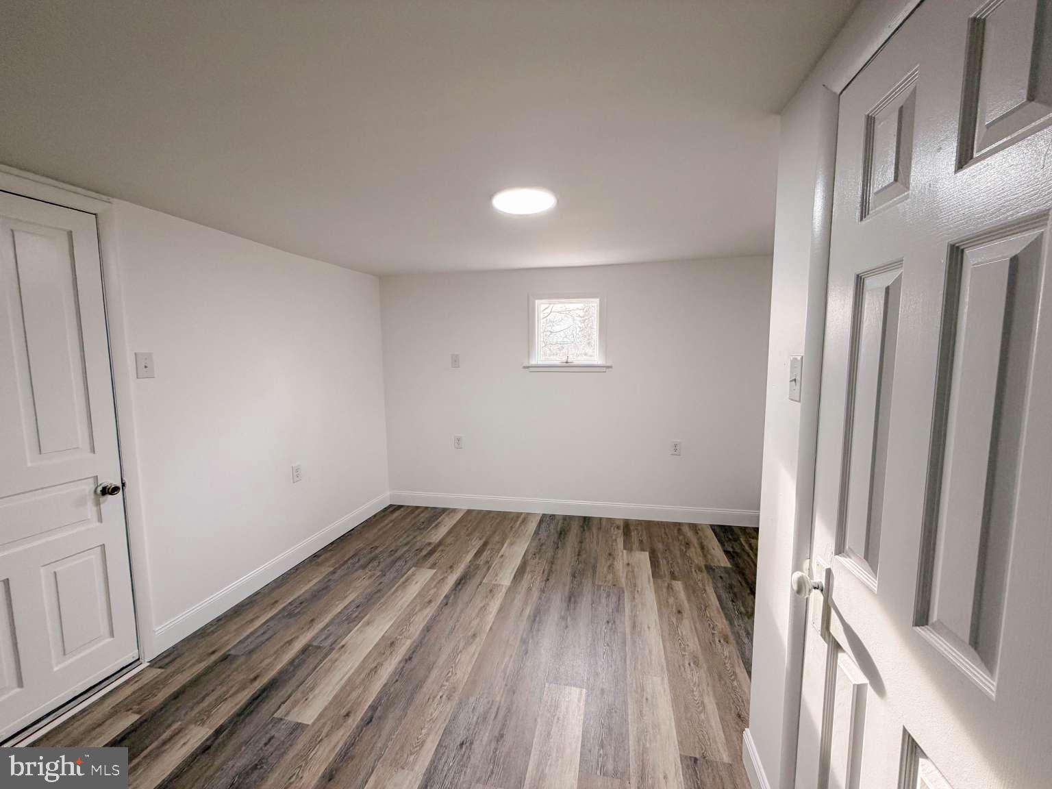 1424 Wayne Street Reading, PA 19601 - Photo 9 of 19 a view of a room with wooden floor and window
