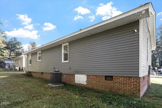 a view of a yard with large trees