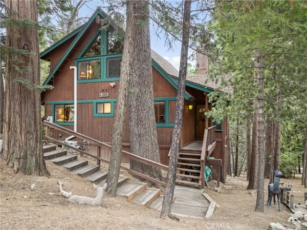 a front view of a house with stairs