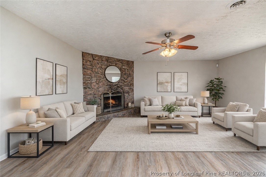 6553 Grist Mill Road Fayetteville, NC 28314 - Photo 13 of 31 a living room with furniture and a large window