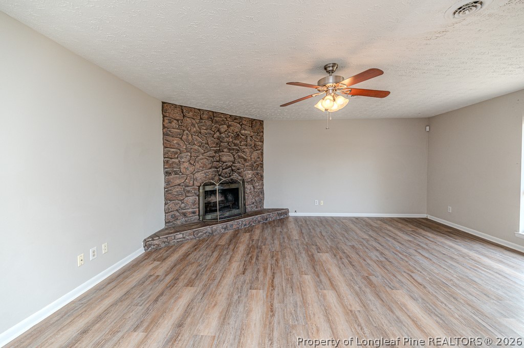 6553 Grist Mill Road Fayetteville, NC 28314 - Photo 14 of 31 wooden floor in an empty room with a window