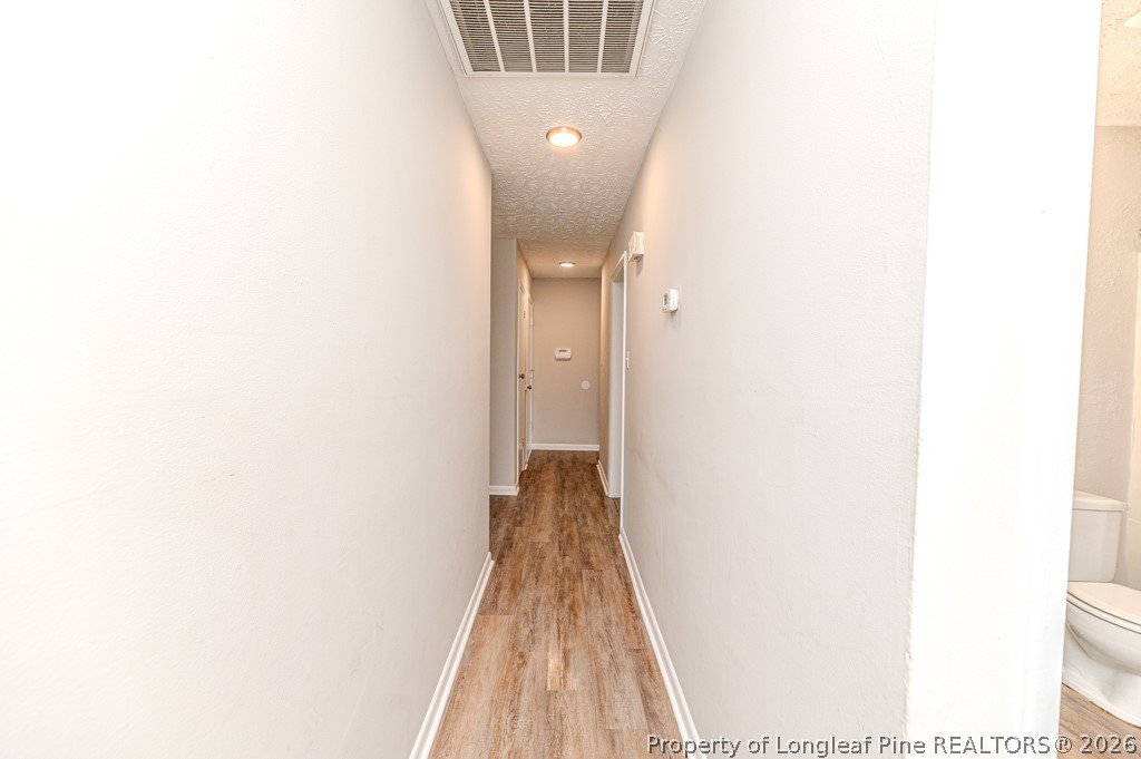 6553 Grist Mill Road Fayetteville, NC 28314 - Photo 17 of 31 a view of a hallway with a white walls