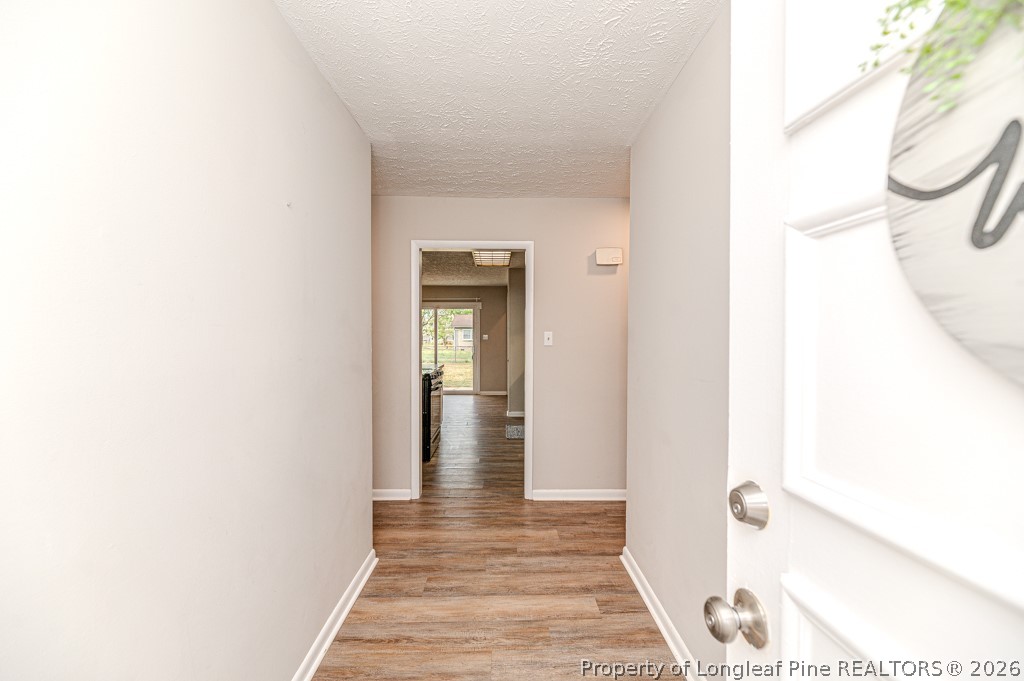 6553 Grist Mill Road Fayetteville, NC 28314 - Photo 2 of 31 a view of a bathroom from a corridor