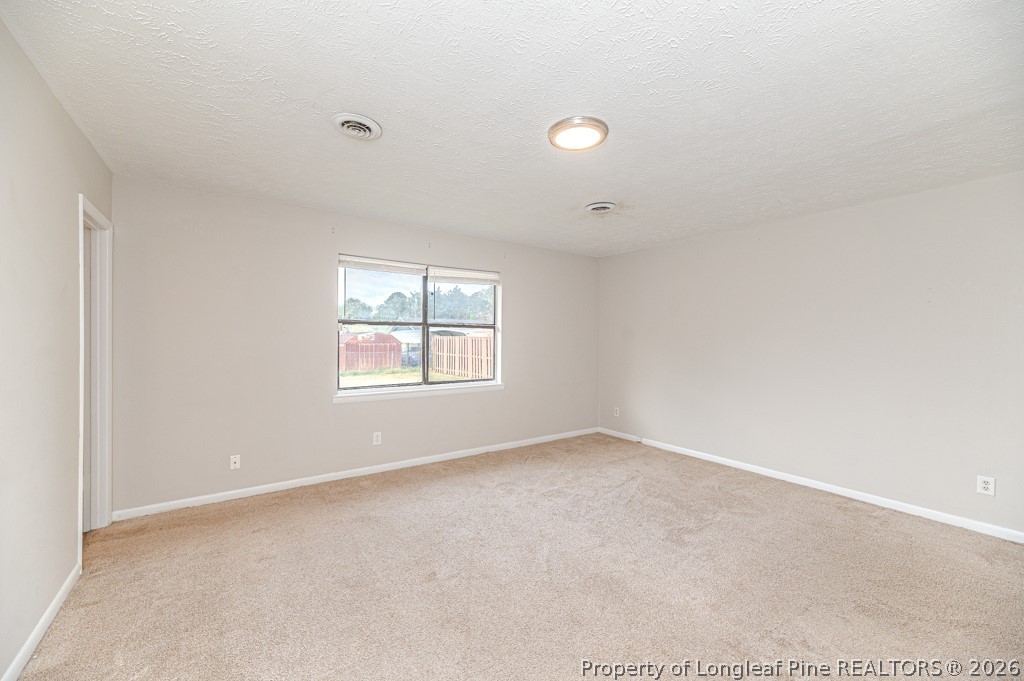 6553 Grist Mill Road Fayetteville, NC 28314 - Photo 22 of 31 an empty room with windows
