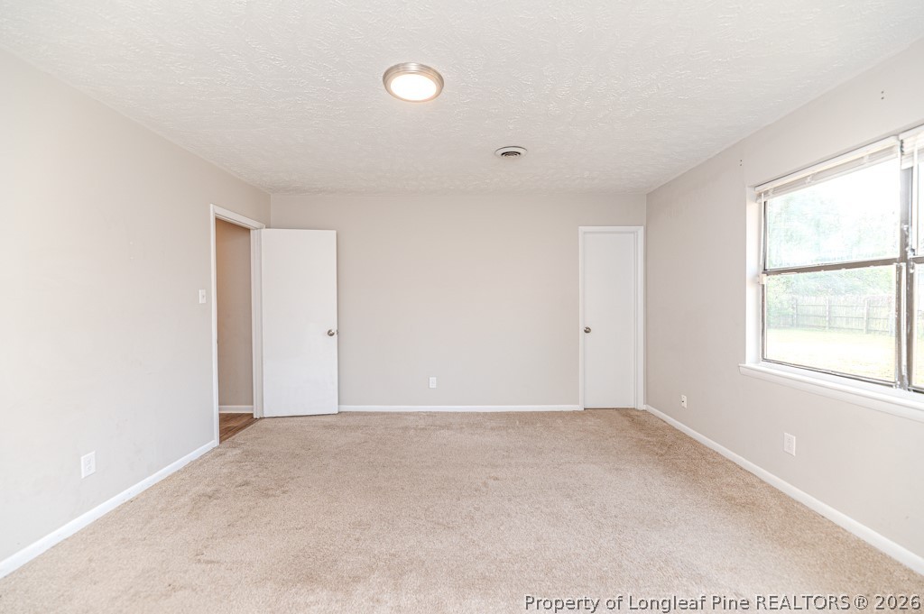 6553 Grist Mill Road Fayetteville, NC 28314 - Photo 28 of 31 a view of an empty room with a window