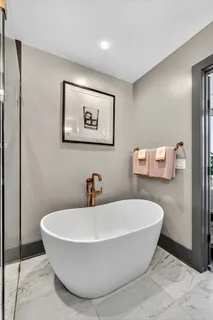 a white bath tub sitting in a bathroom
