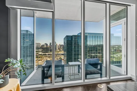 a view of a balcony and floor to ceiling window
