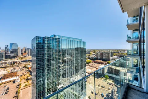 a view of city with tall buildings