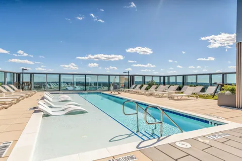 a view of a kitchen with kitchen island a large island in it