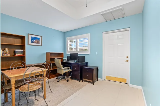 a bathroom with a granite countertop sink toilet mirror and shower