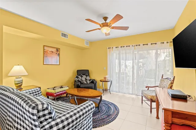 a living room with furniture and a lamp