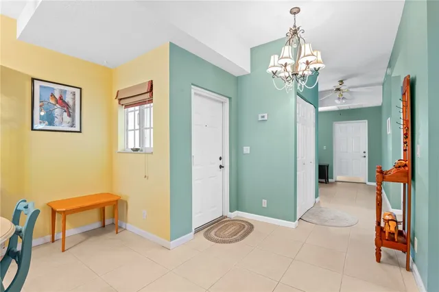 a kitchen with a refrigerator and a stove