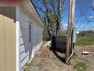 189 St Albans Road Corinna, ME 04928 - Photo 4 of 30 right side of garage showing meter and o