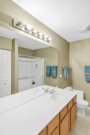a bathroom with a sink vanity and a mirror