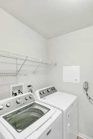 a utility room with dryer and washer