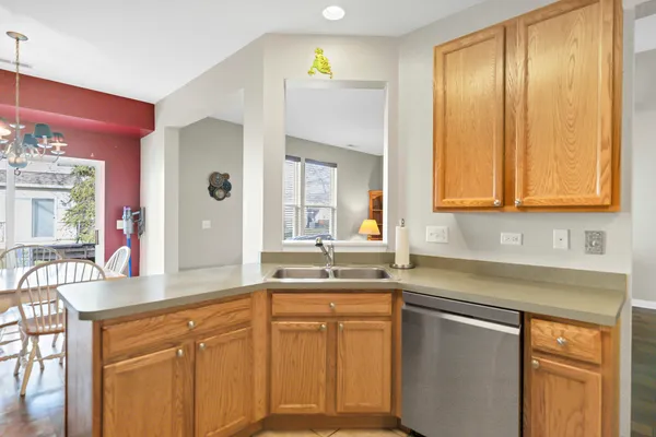 a kitchen with stainless steel appliances granite countertop a sink and cabinets