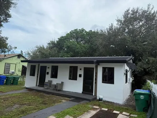front view of a house with a yard