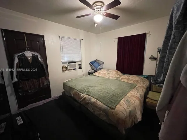 a view of walk in closet with clothes
