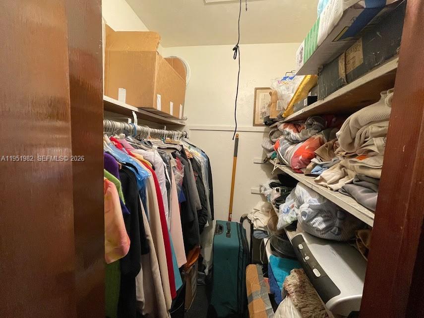 1786 Northwest 53rd Street Miami, FL 33142 - Photo 15 of 20 a view of walk in closet with clothes