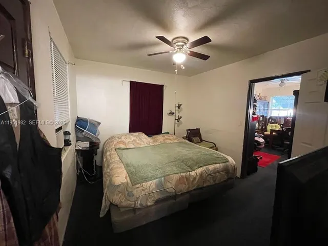 a living room with furniture and a mirror