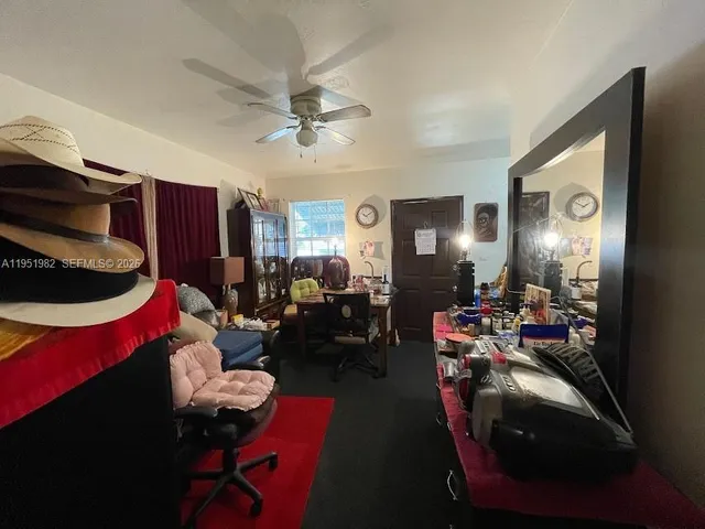 a living room with furniture and a large mirror