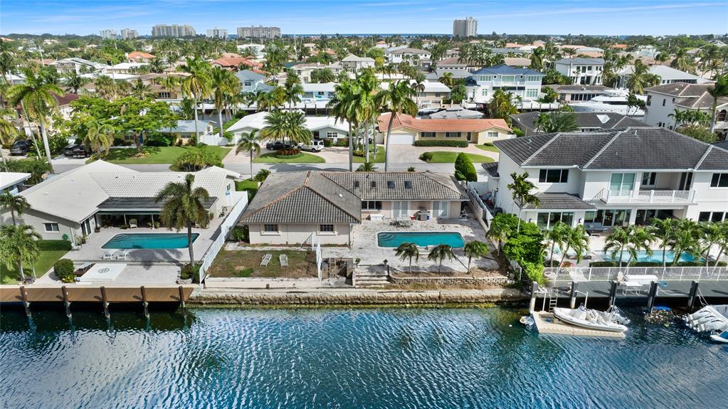 3801 Northeast 24th Avenue Lighthouse Point, FL 33064 - Photo 7 of 8 a aerial view of a houses with a lake view