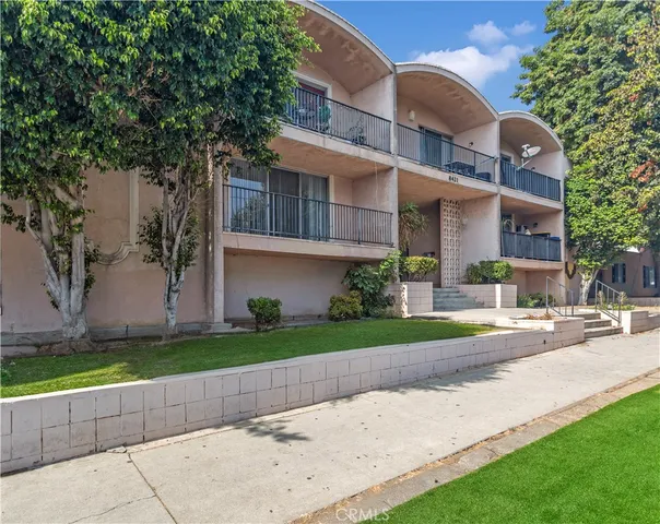 a front view of a house with a yard and a garage