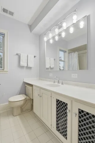 a bed room with a bed and a night stand