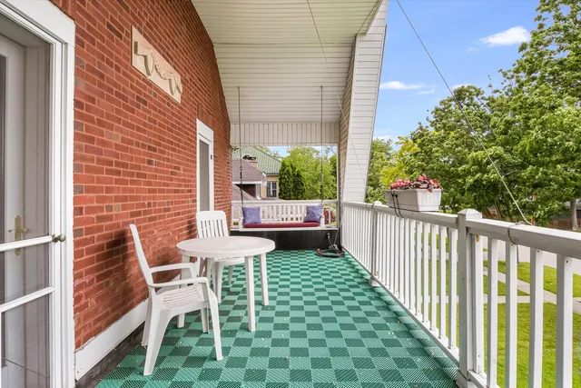 a view of balcony with wooden floor