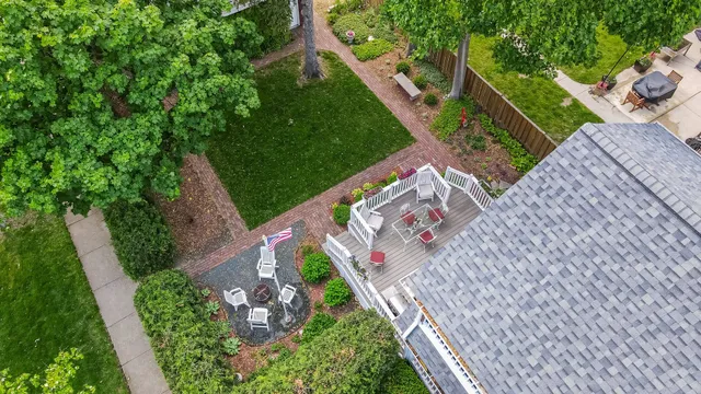 a picture of a bench in front of a gate