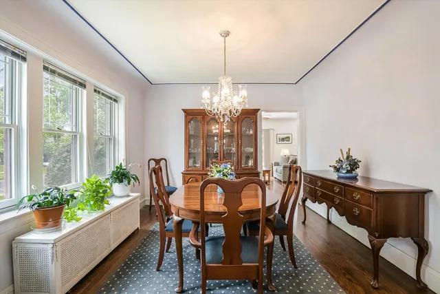 a kitchen with refrigerator cabinets and wooden floor