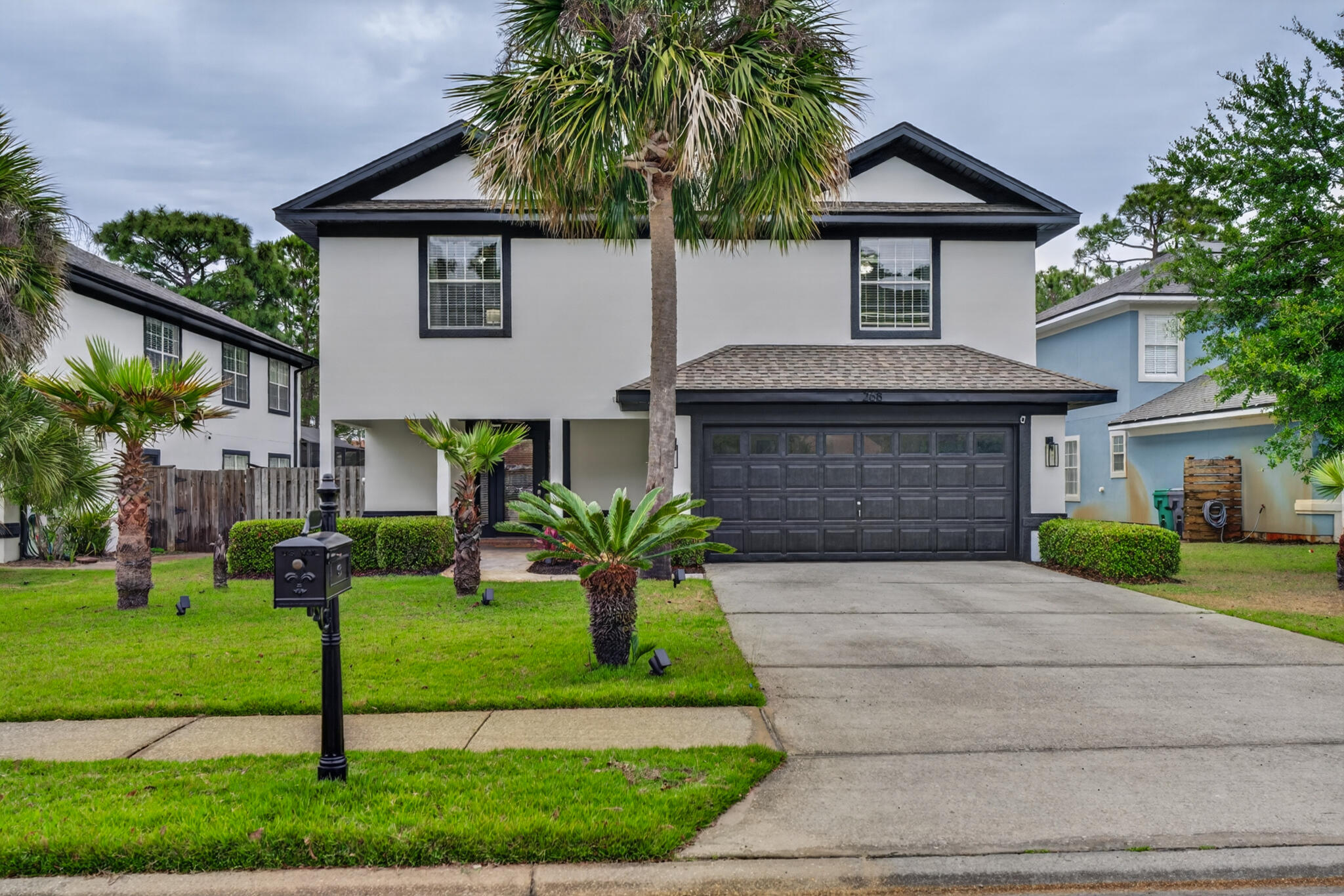268 Loblolly Bay Drive Santa Rosa Beach, FL 32459 - Photo 62 of 73 a front view of a house with a yard and garage