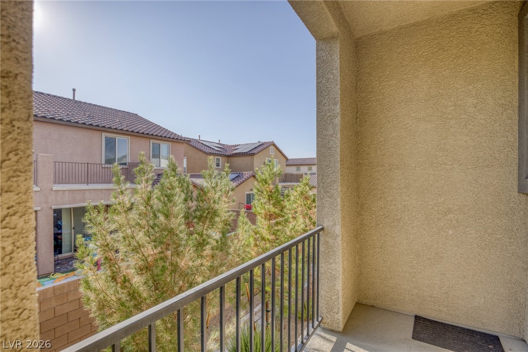 6227 Runestone Street Las Vegas, NV 89113 - Photo 28 of 33 Enjoy peaceful moments on this charming balcony, offering an inviting outdoor retreat.