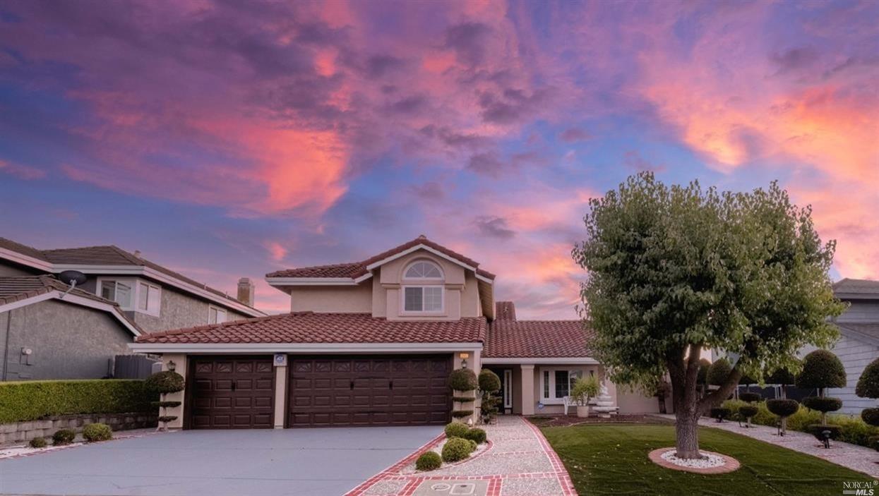 a front view of a house with garden