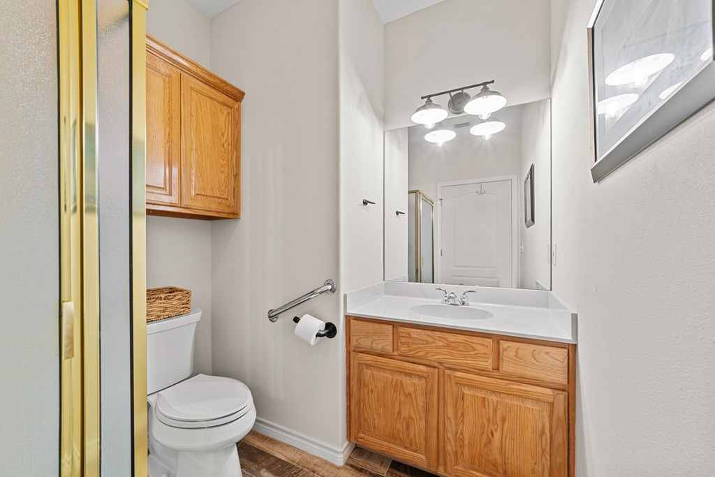 1008 Edinburgh Drive Kerrville, TX 78028 - Photo 15 of 25 a bathroom with a sink a toilet and a mirror