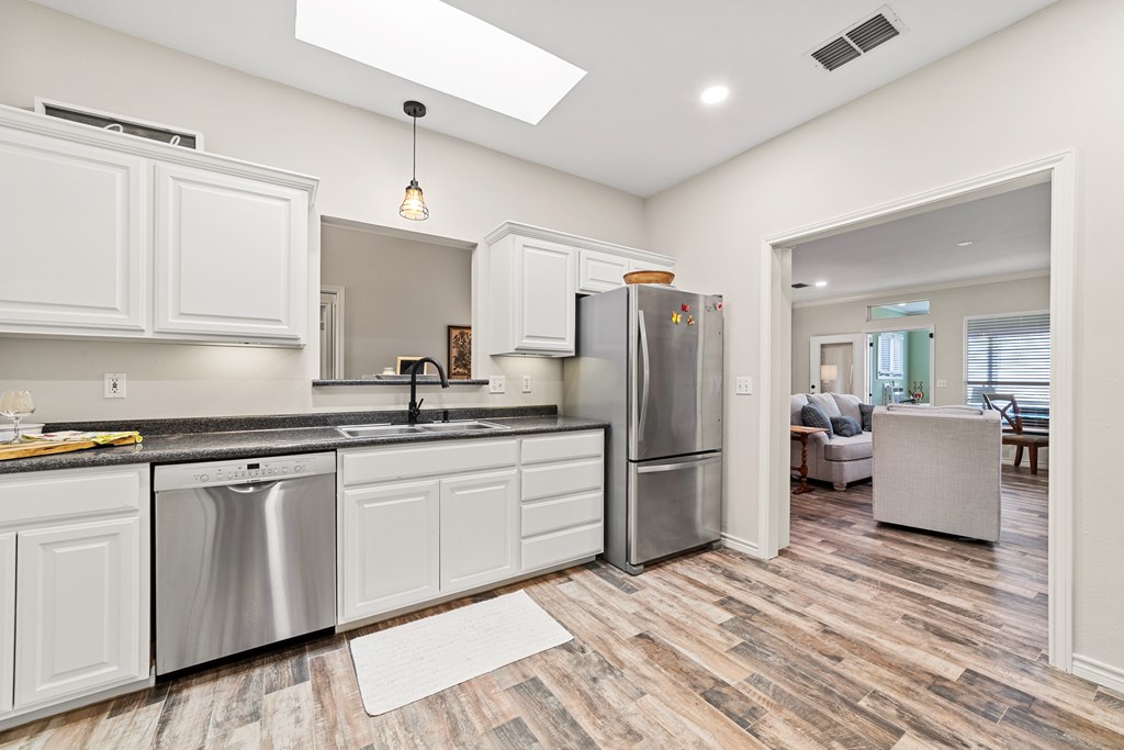 1008 Edinburgh Drive Kerrville, TX 78028 - Photo 6 of 25 a kitchen with refrigerator and cabinets