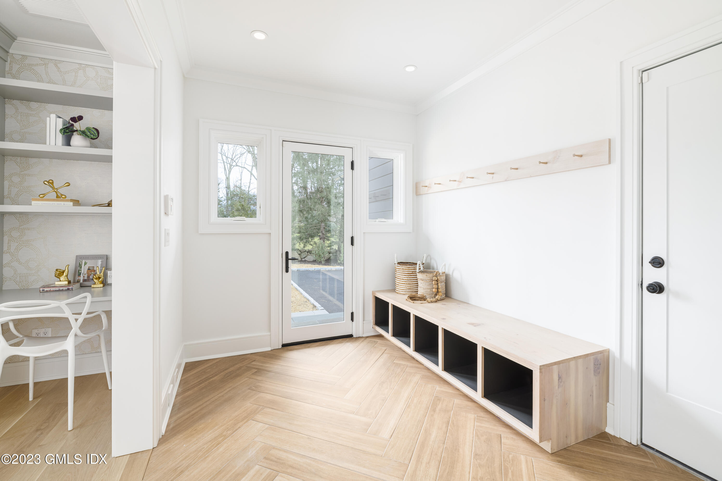 261 Cognewaugh Road Cos Cob, CT 06807 - Photo 12 of 38 a hallway with a large window and a kitchen view