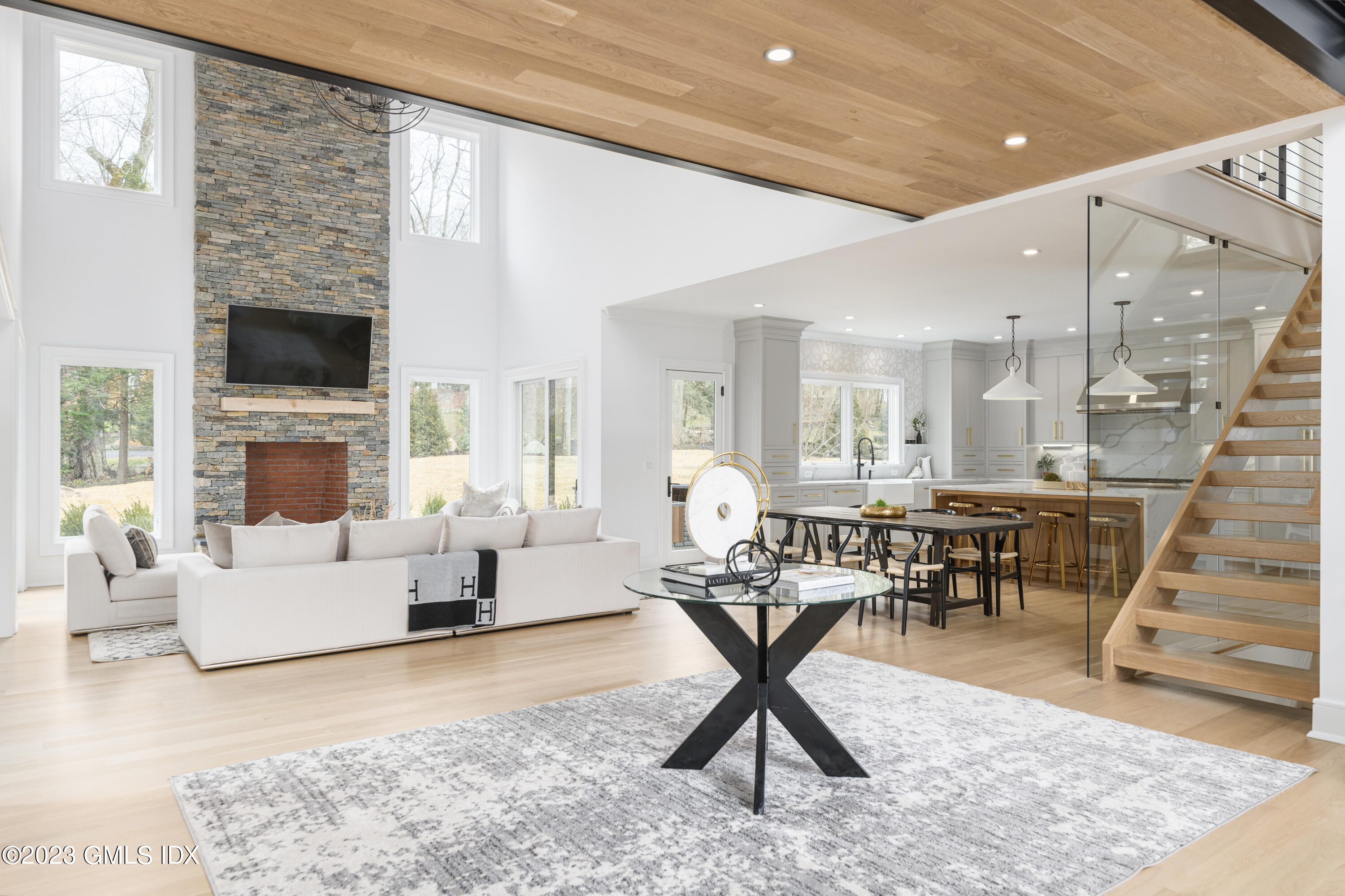 261 Cognewaugh Road Cos Cob, CT 06807 - Photo 15 of 38 a living room with furniture and a fireplace