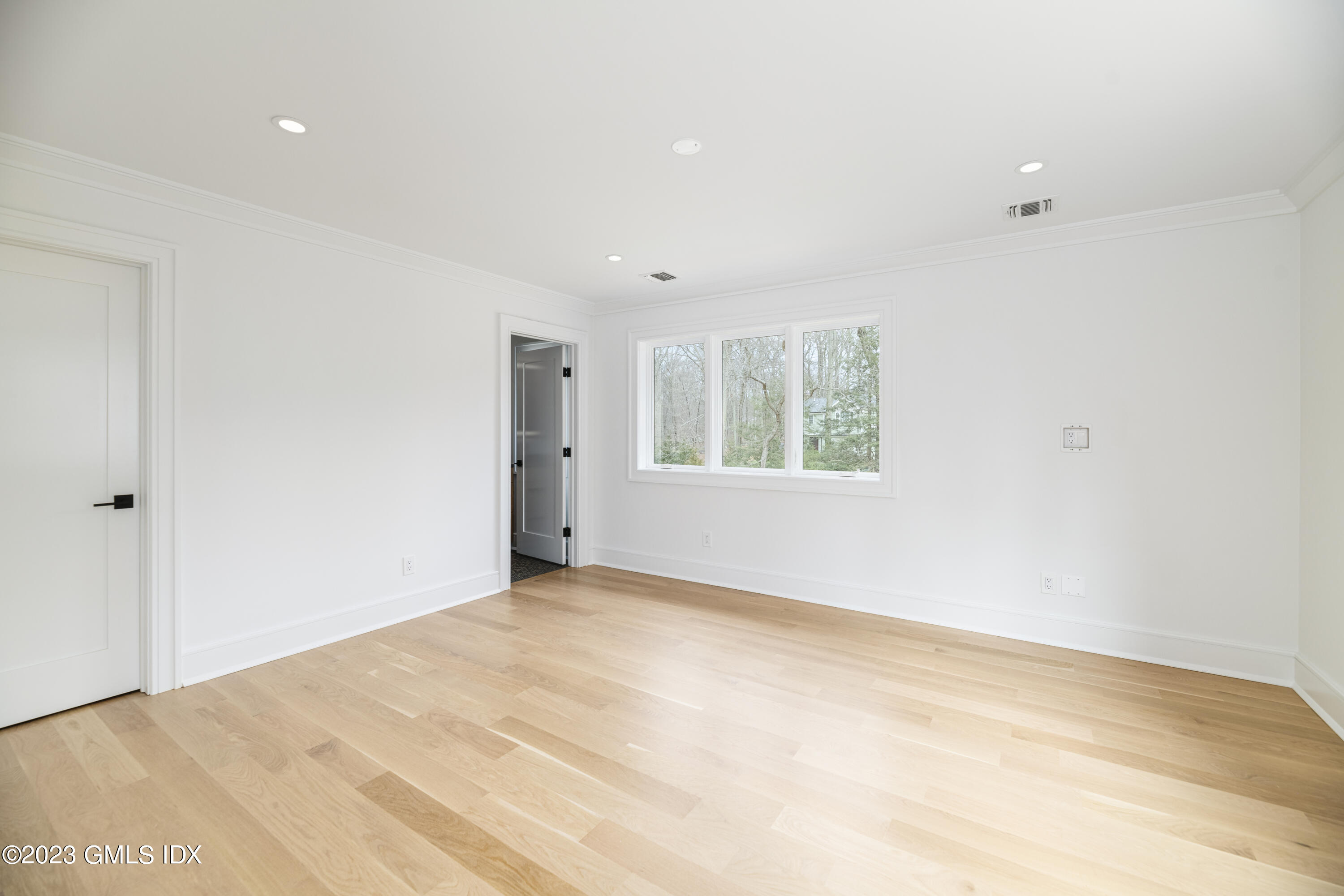 261 Cognewaugh Road Cos Cob, CT 06807 - Photo 24 of 38 a view of an empty room with a window