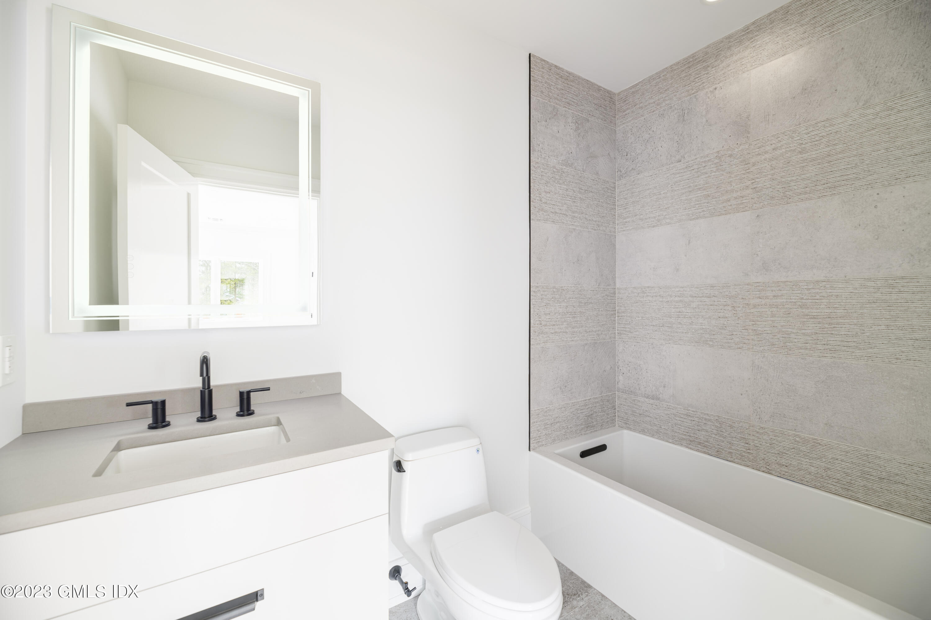 261 Cognewaugh Road Cos Cob, CT 06807 - Photo 29 of 38 a bathroom with a sink a toilet and shower