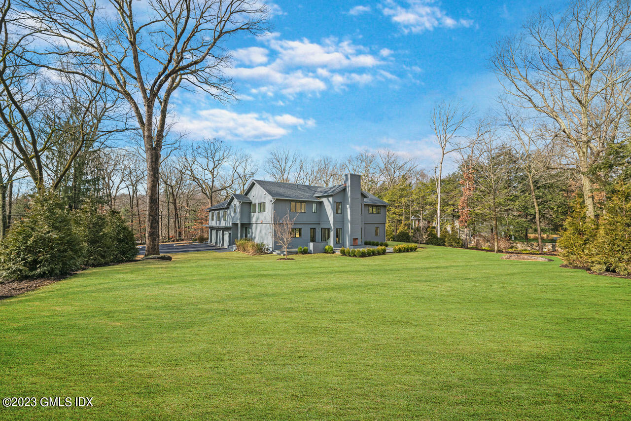 261 Cognewaugh Road Cos Cob, CT 06807 - Photo 34 of 38 a view of a big yard with large trees