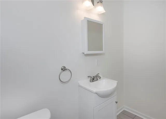 a bathroom with a sink and mirror