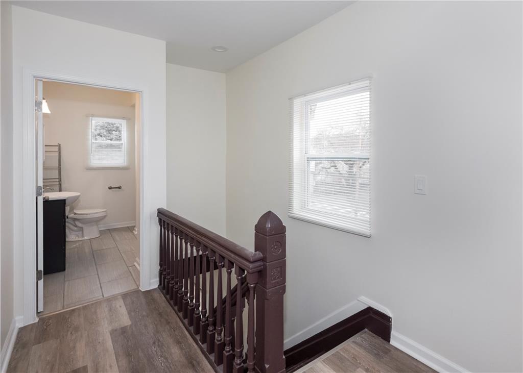 1101 2nd Avenue Coraopolis, PA 15108 - Photo 15 of 26 a view of a hallway with a toilet and a window