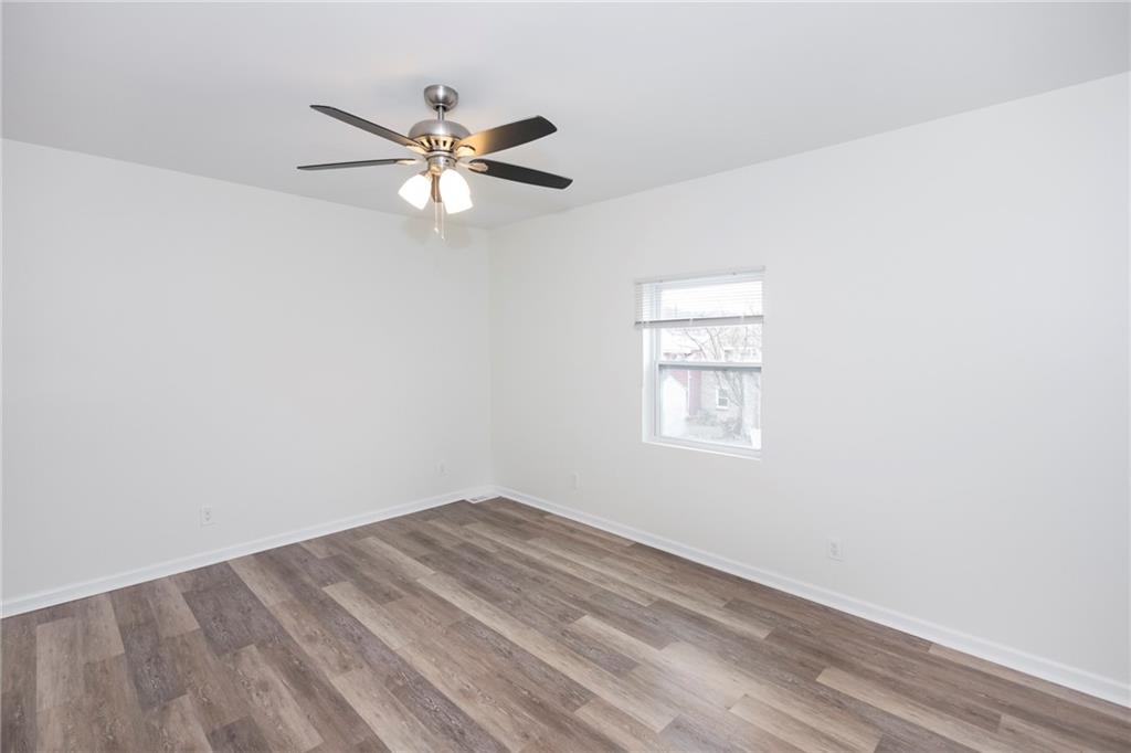 1101 2nd Avenue Coraopolis, PA 15108 - Photo 16 of 26 a view of a big room with wooden floor and windows in a room