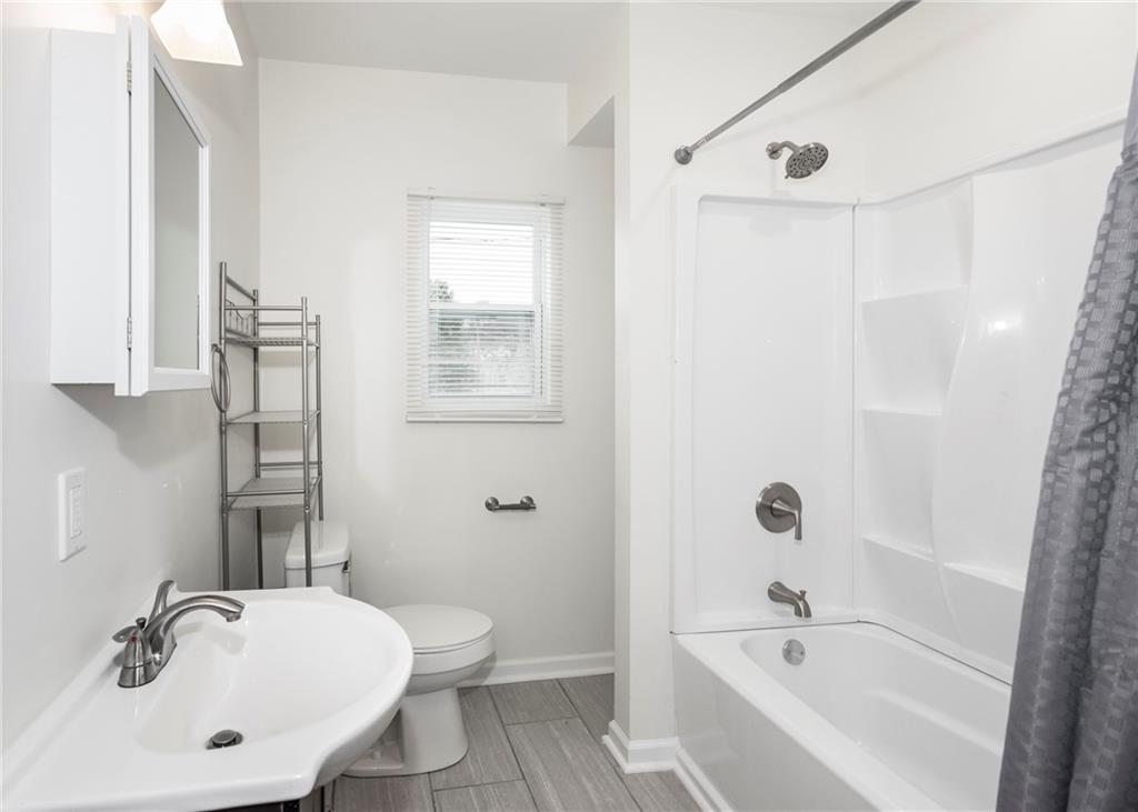 1101 2nd Avenue Coraopolis, PA 15108 - Photo 18 of 26 a bathroom with a sink a toilet and shower