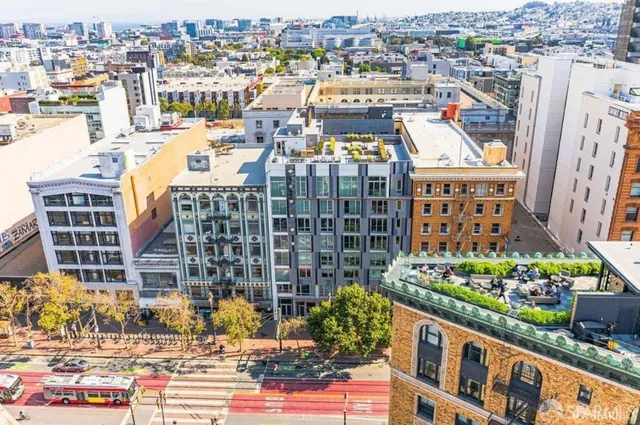 a view of a building with a window and refrigerator