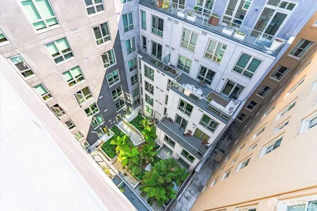 a kitchen with stainless steel appliances a sink a stove and cabinets