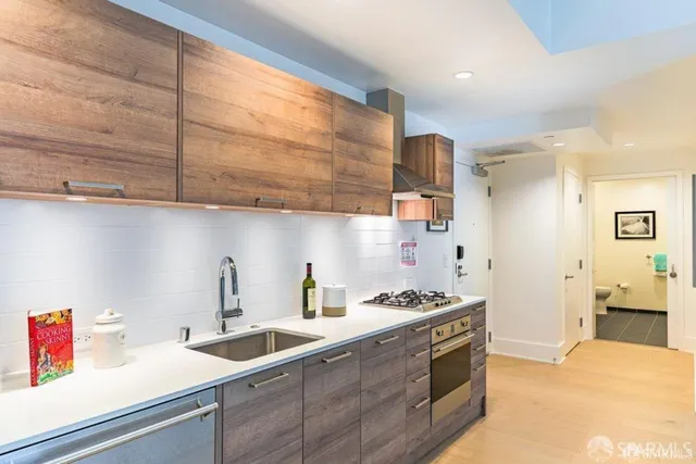 a bedroom with furniture and a large window